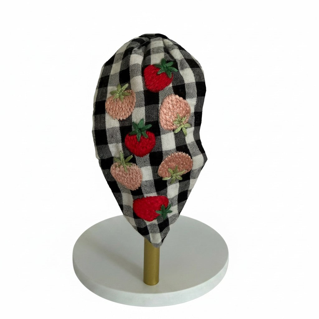 The Marigold Story handcrafted black and white gingham headband with red and blush pink embroidered strawberry motifs.
