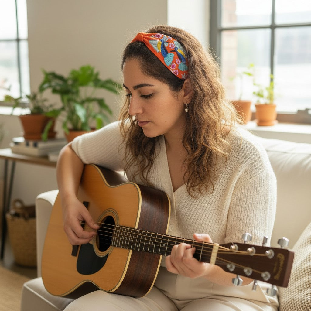 The Marigold Story orange tropical toucan embroidered headband.