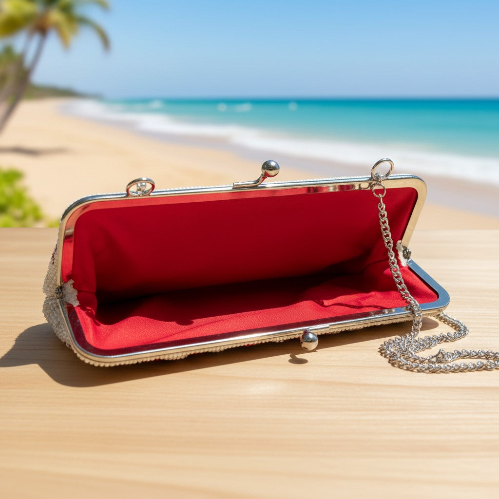 The Marigold Story handcrafted white beaded sling bag with a red interior and metal frame